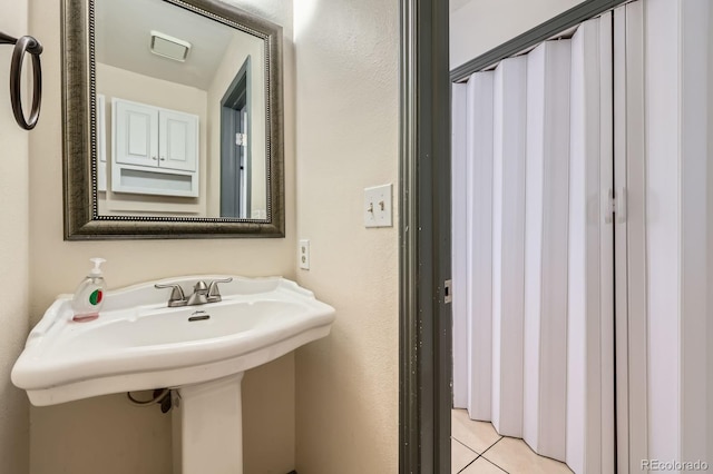 3320 Simmelink Loop, Colorado Springs, CO 80916 - bathroom with tile patterned flooring and a sink