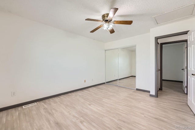 3320 Simmelink Loop, Colorado Springs, CO 80916 - unfurnished bedroom with light wood finished floors, a closet, baseboards, attic access, and ceiling fan