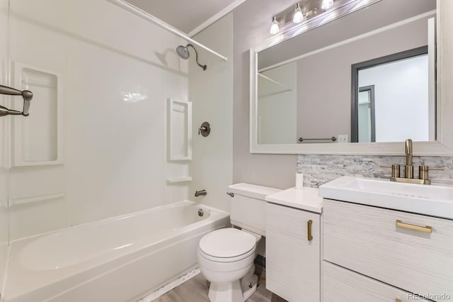 3320 Simmelink Loop, Colorado Springs, CO 80916 - bathroom with toilet, tub / shower combination, decorative backsplash, vanity, and ornamental molding