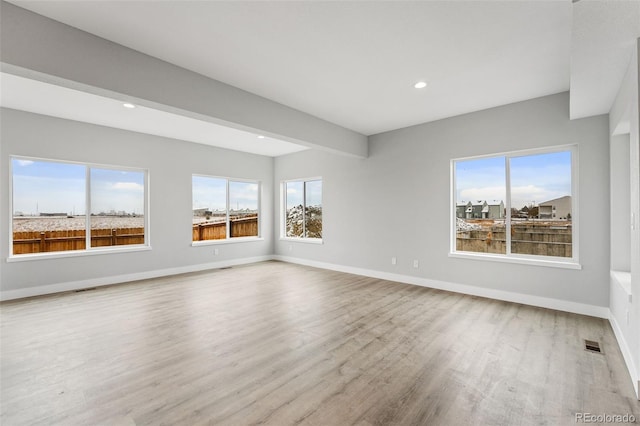 spare room with wood-type flooring