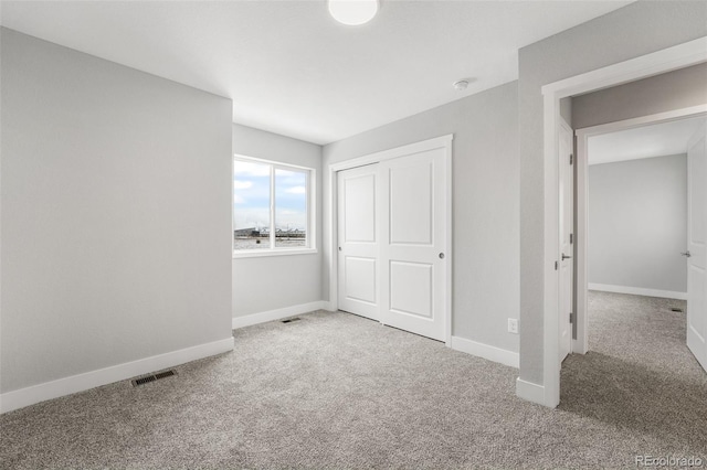 unfurnished bedroom featuring carpet