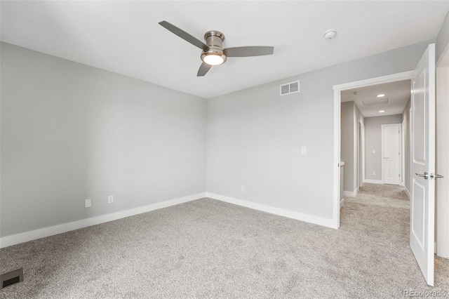 carpeted empty room featuring ceiling fan