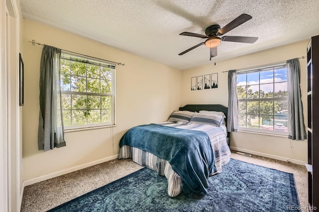 7881 Allison Way Unit 303, Arvada, CO 80005 - carpeted bedroom with a textured ceiling and a ceiling fan