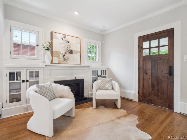 660 S Clarkson St, Denver, CO 80209 - sitting room featuring ornamental molding, wood finished floors, a fireplace, and recessed lighting