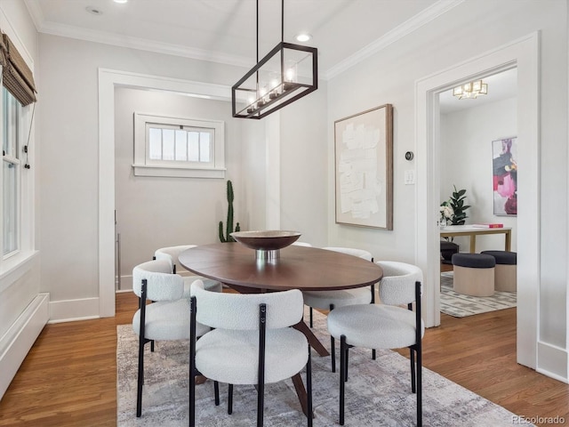 660 S Clarkson St, Denver, CO 80209 - dining space featuring a chandelier, wood finished floors, ornamental molding, recessed lighting, and baseboards