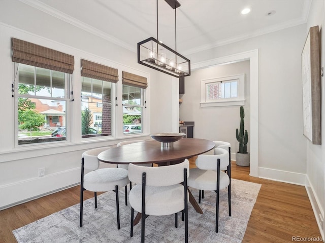660 S Clarkson St, Denver, CO 80209 - dining room featuring ornamental molding, baseboards, a chandelier, wood finished floors, and recessed lighting