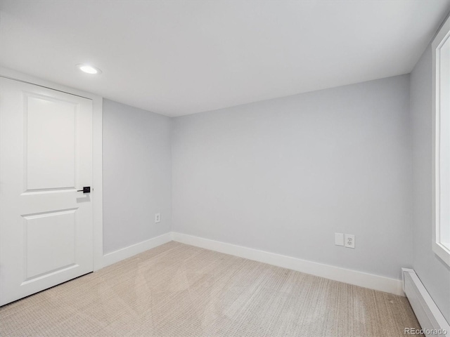 660 S Clarkson St, Denver, CO 80209 - empty room featuring a baseboard heating unit, carpet, recessed lighting, and baseboards