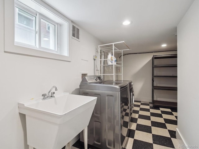660 S Clarkson St, Denver, CO 80209 - laundry room featuring washing machine and dryer, tile patterned floors, and recessed lighting