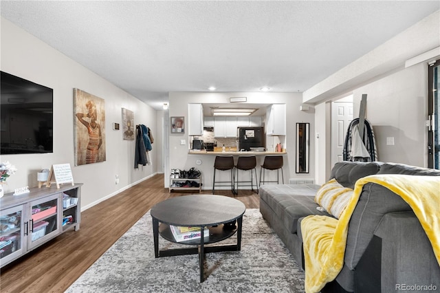 16001 E Alaska Pl Unit 12, Aurora, CO 80017 - living room featuring wood finished floors and recessed lighting