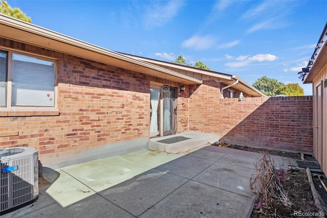 view of patio / terrace with fence and central AC