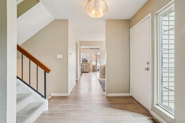 7925 W Layton Ave Unit 500, Littleton, CO 80123 - entrance foyer with wood finished floors, stairway, and baseboards