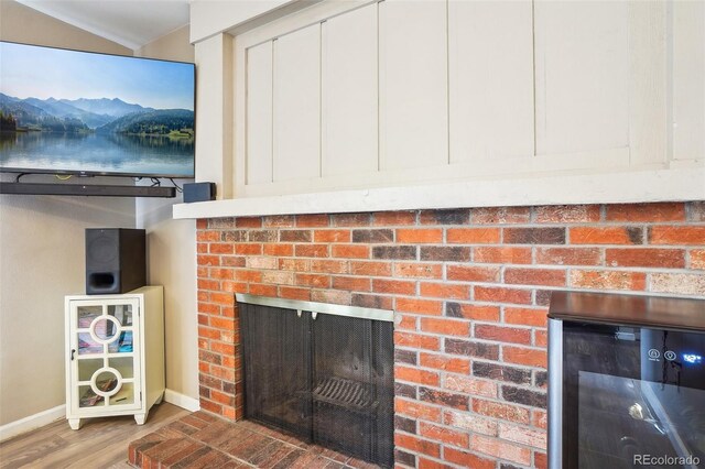 7925 W Layton Ave Unit 500, Littleton, CO 80123 - detailed view of a fireplace, wood finished floors, and baseboards