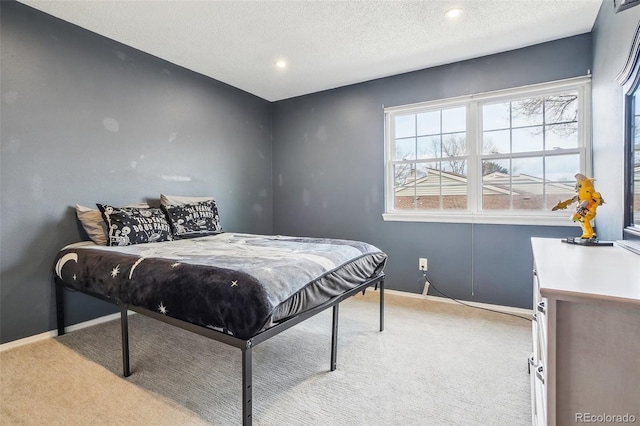 7925 W Layton Ave Unit 500, Littleton, CO 80123 - bedroom with light colored carpet, baseboards, a textured ceiling, and recessed lighting