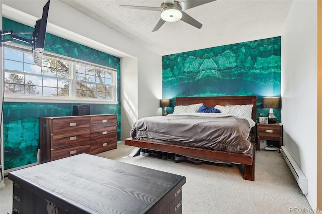 7925 W Layton Ave Unit 500, Littleton, CO 80123 - bedroom featuring baseboard heating, carpet floors, a ceiling fan, and a textured ceiling