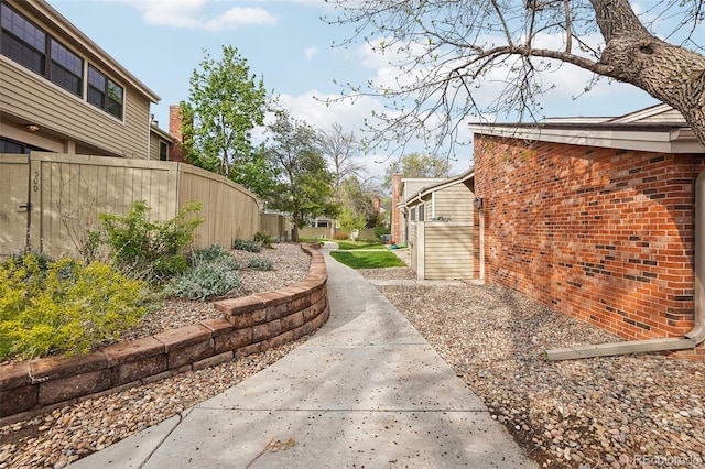 7925 W Layton Ave Unit 500, Littleton, CO 80123 - view of home's exterior featuring fence and brick siding