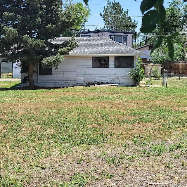 256 S 2nd Ave, Brighton, CO 80601 - back of house featuring roof with shingles