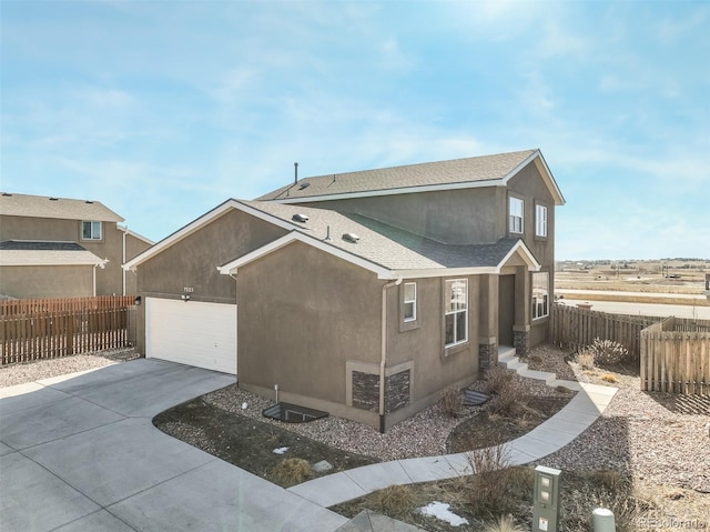 view of side of home featuring a garage