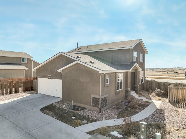 view of side of home featuring a garage