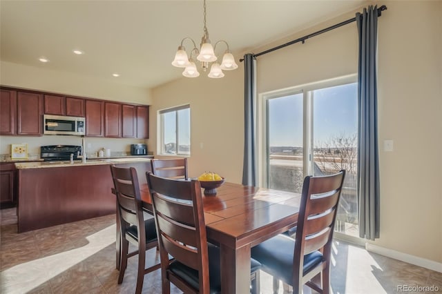 dining space with a notable chandelier