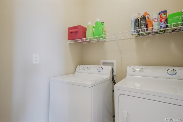 washroom with independent washer and dryer