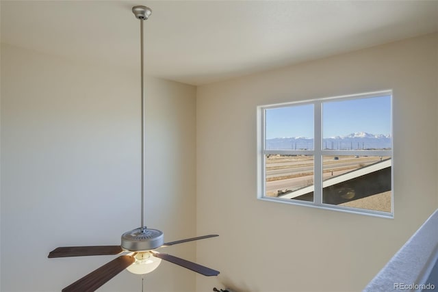 interior details featuring ceiling fan and a mountain view