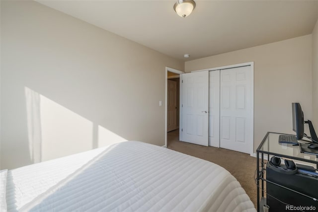 carpeted bedroom featuring a closet