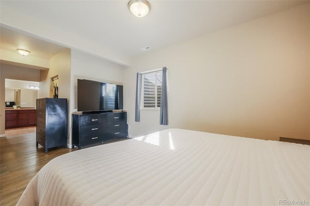 bedroom featuring wood-type flooring