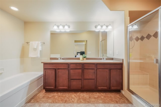 bathroom with shower with separate bathtub and vanity