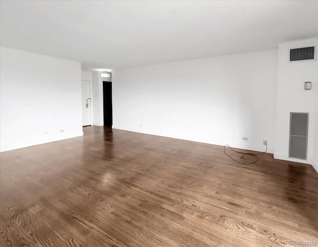 empty room featuring wood finished floors