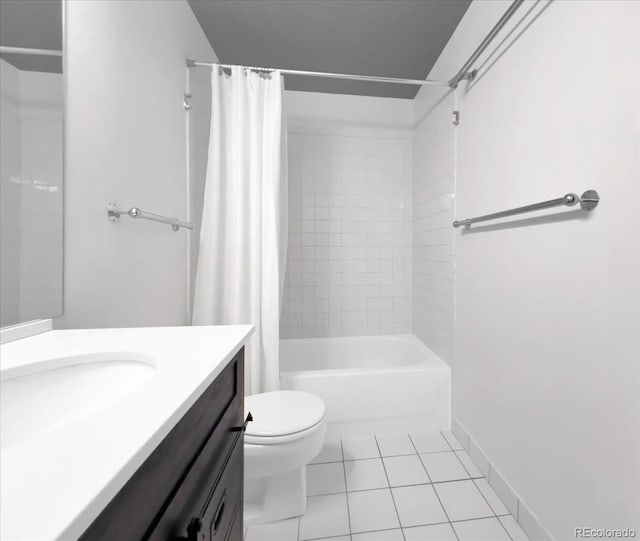 full bath with tile patterned floors, toilet, vanity, baseboards, and shower / tub combo with curtain
