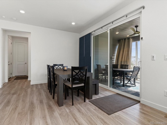 dining room featuring recessed lighting, light wood-type flooring, and baseboards