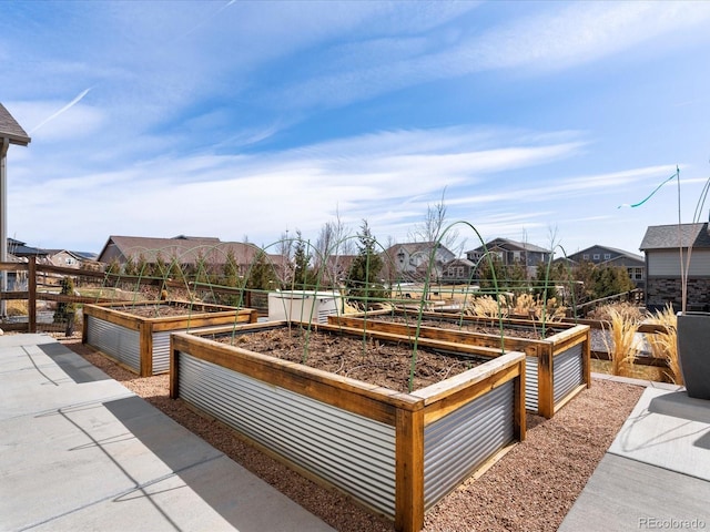 view of patio featuring a vegetable garden and a residential view