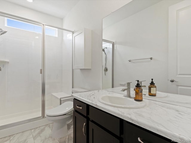 full bathroom featuring vanity, a shower stall, toilet, and marble finish floor