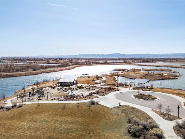 aerial view featuring a water and mountain view