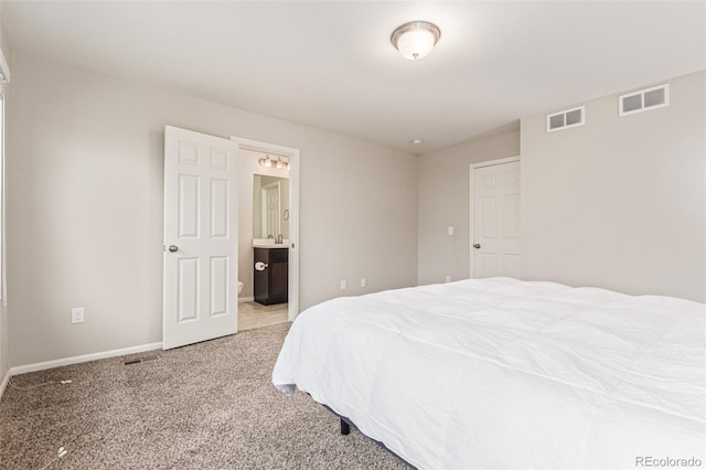 18112 E 104th Way, Commerce City, CO 80022 - bedroom with carpet floors, baseboards, and ensuite bath