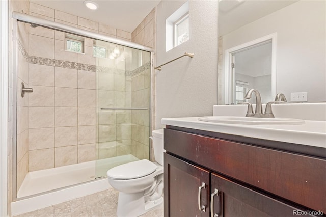 18112 E 104th Way, Commerce City, CO 80022 - bathroom with toilet, vanity, and a stall shower