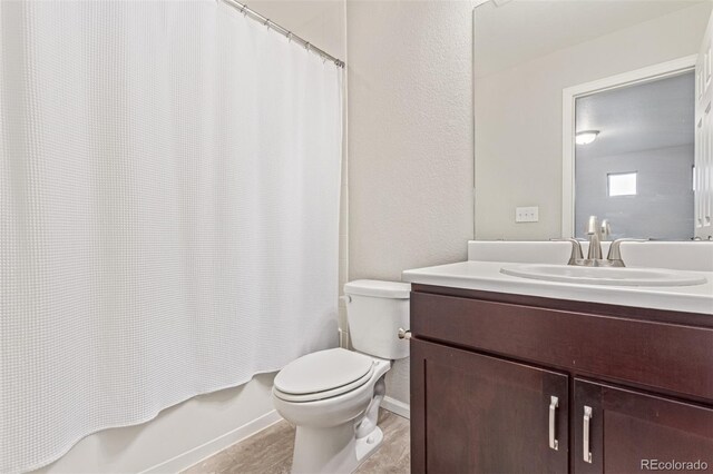 18112 E 104th Way, Commerce City, CO 80022 - full bath with vanity, toilet, shower / bath combo, and a textured wall
