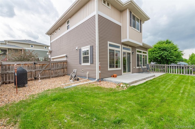 18112 E 104th Way, Commerce City, CO 80022 - rear view of house with a patio area