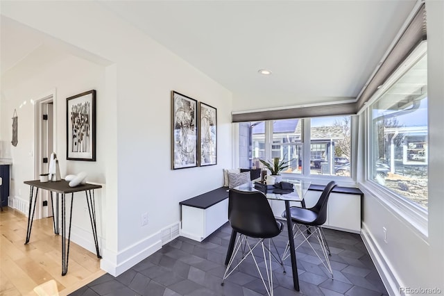 dining space featuring dark wood-style floors, visible vents, baseboards, and recessed lighting