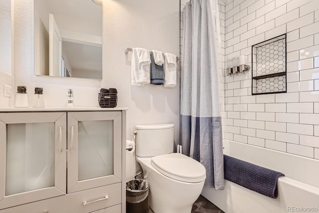 bathroom featuring toilet, shower / bath combo, and vanity