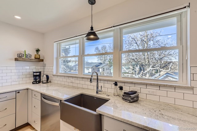 kitchen featuring a sink, backsplash, stainless steel dishwasher, and open shelves