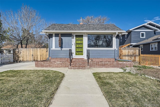 4441 N Meade St, Denver, CO 80211 - bungalow-style house with fence, a shingled roof, and a front yard