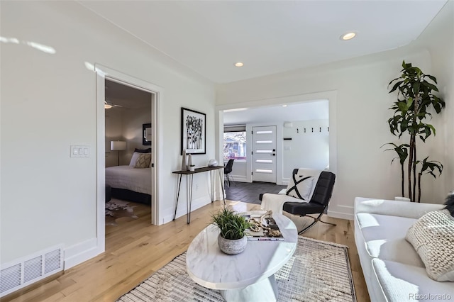 4441 N Meade St, Denver, CO 80211 - living area featuring recessed lighting, baseboards, visible vents, and light wood finished floors