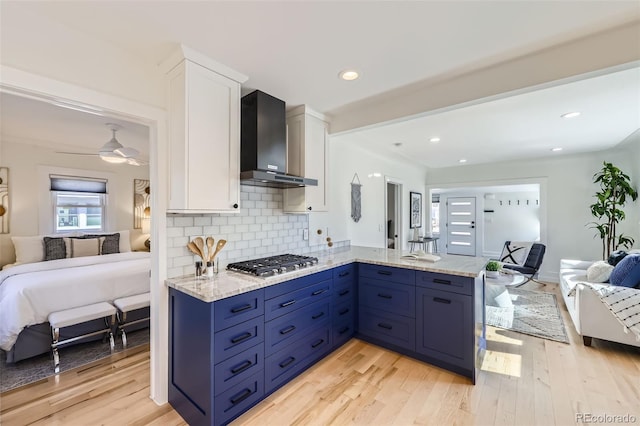 4441 N Meade St, Denver, CO 80211 - kitchen featuring open floor plan, a healthy amount of sunlight, stainless steel gas stovetop, and wall chimney exhaust hood