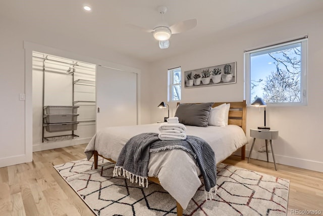 4441 N Meade St, Denver, CO 80211 - bedroom featuring a ceiling fan, baseboards, multiple windows, and light wood-style floors