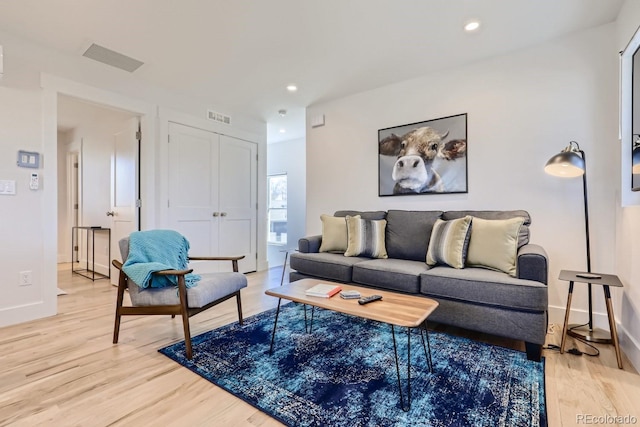 4441 N Meade St, Denver, CO 80211 - living area with recessed lighting, baseboards, visible vents, and light wood-style floors