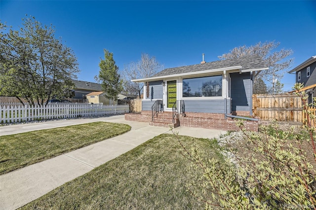 4441 N Meade St, Denver, CO 80211 - bungalow featuring brick siding, fence private yard, and a front lawn