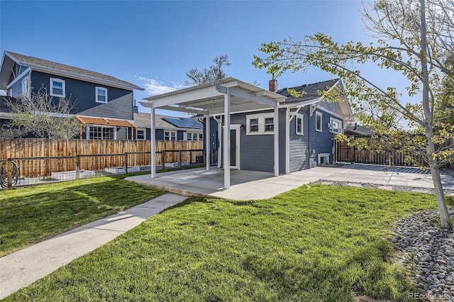 4441 N Meade St, Denver, CO 80211 - view of front of house with a chimney, a patio area, fence, and a front yard