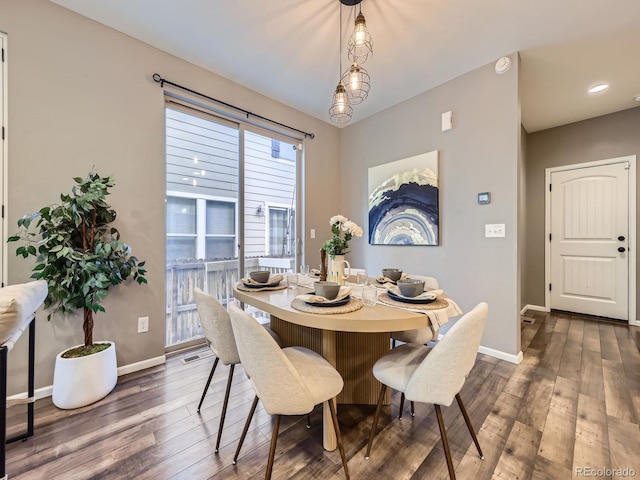 15269 W 69th Cir Unit A, Arvada, CO 80007 - dining space featuring dark wood-style floors and baseboards