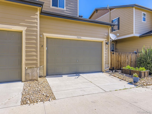 15269 W 69th Cir Unit A, Arvada, CO 80007 - garage featuring concrete driveway